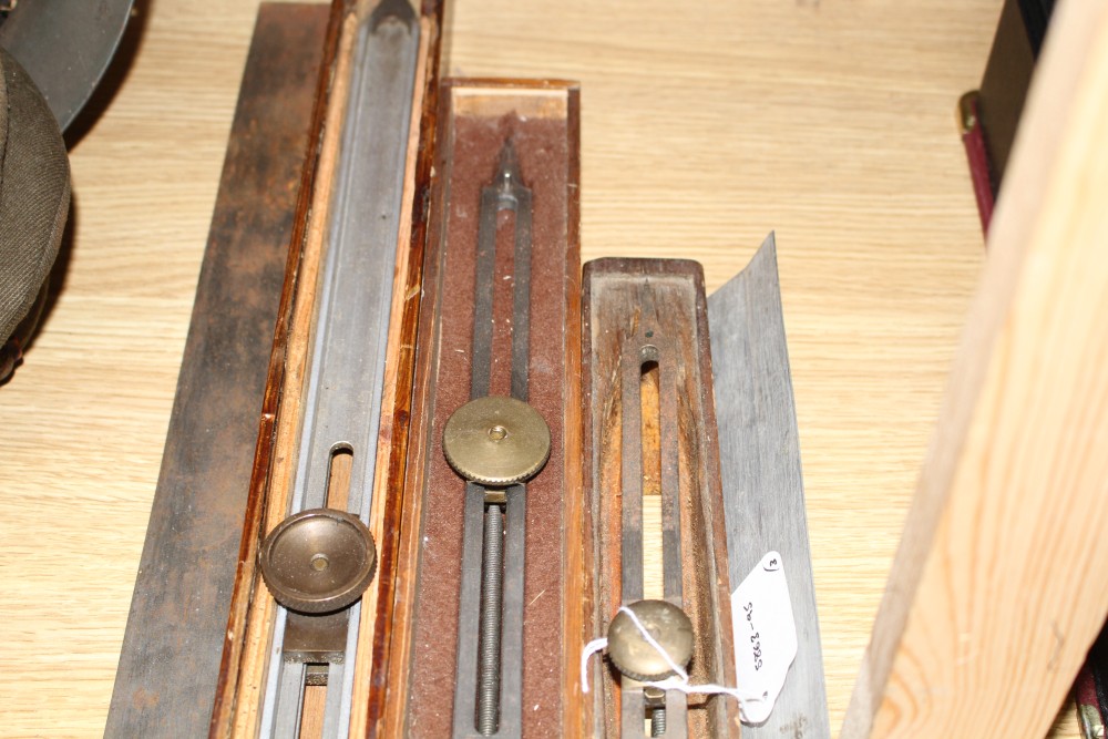 Three wooden cased technical draughtsman tools, stamped for the owner FJ Pearl, largest 77cm